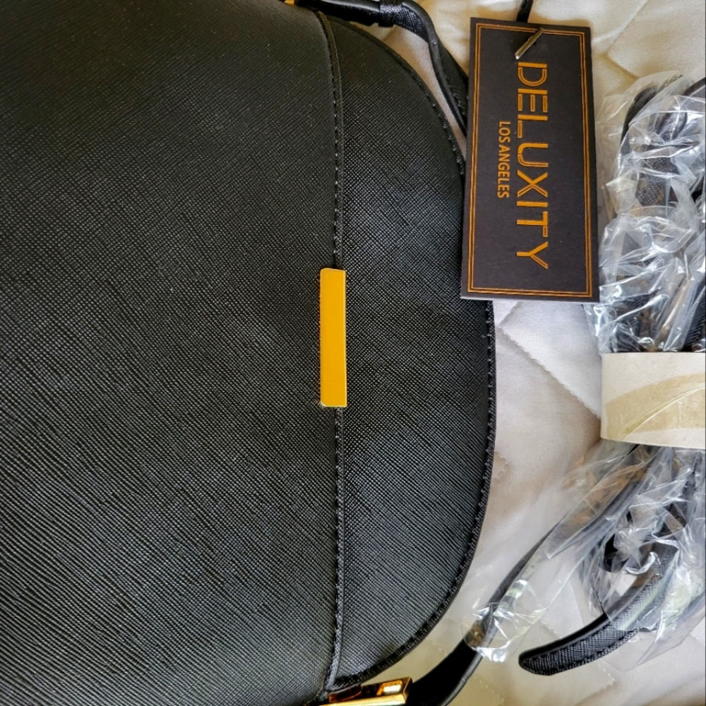 NWT/Small black shoulder strap purse new with tags.
